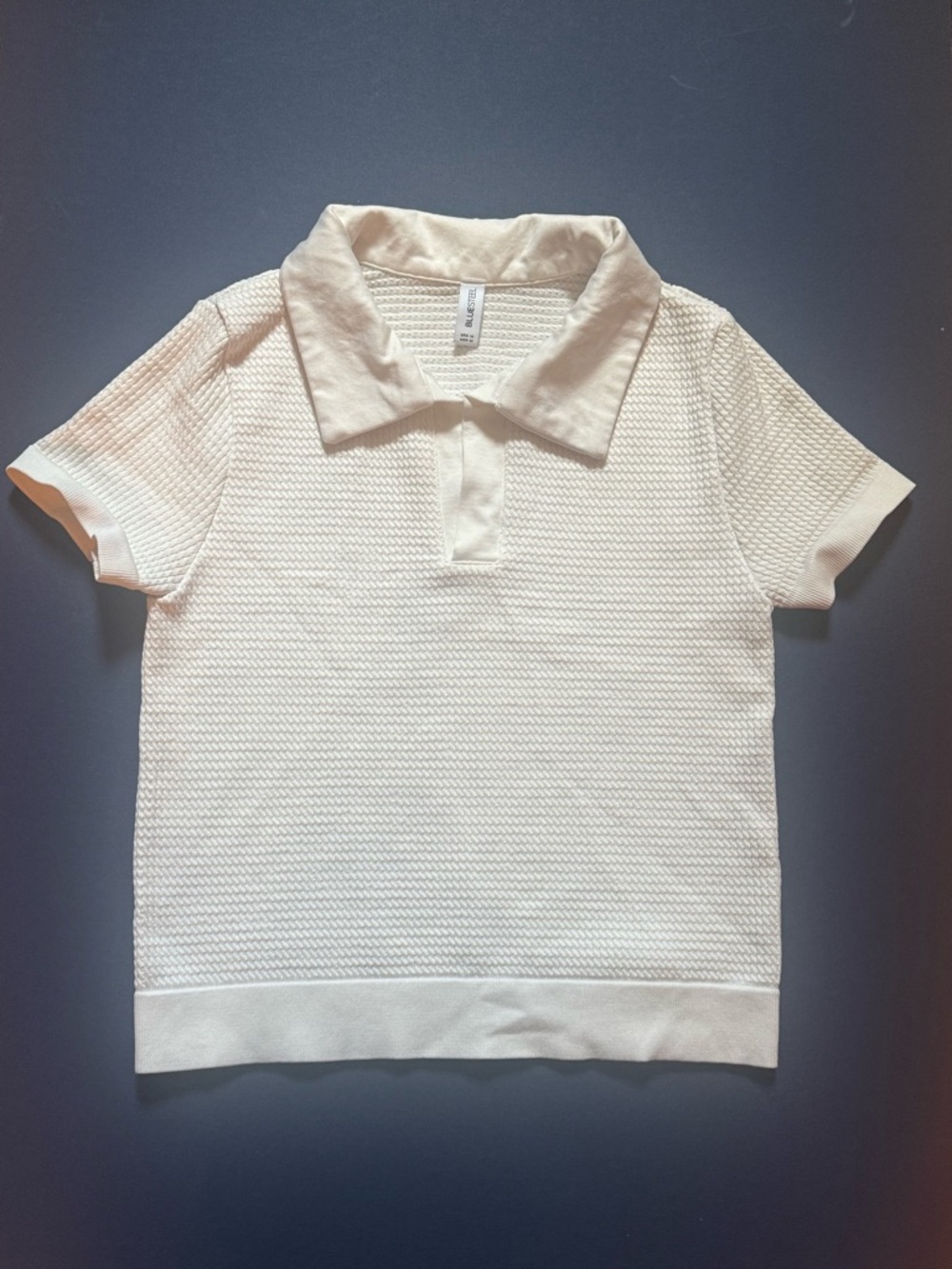 Women's White Textured Polo Top made with stretchy fabric